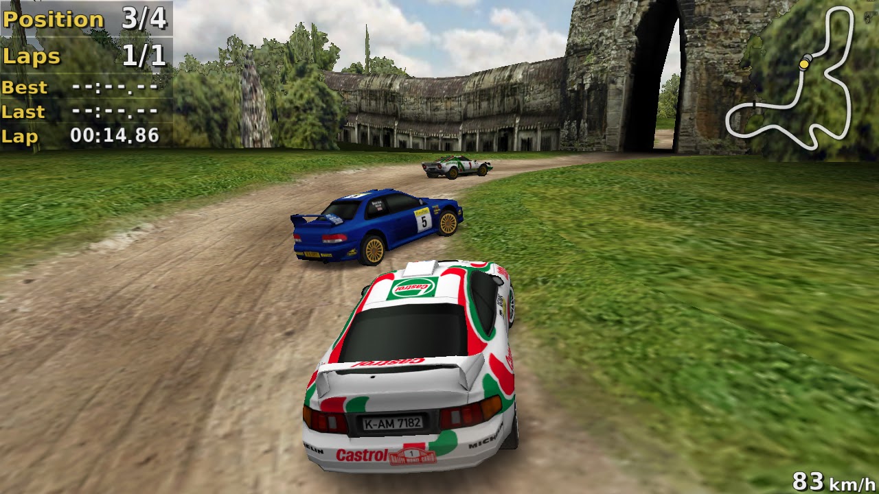 Racing in third place on a dirt road past temple ruins, with lap timer and minimap