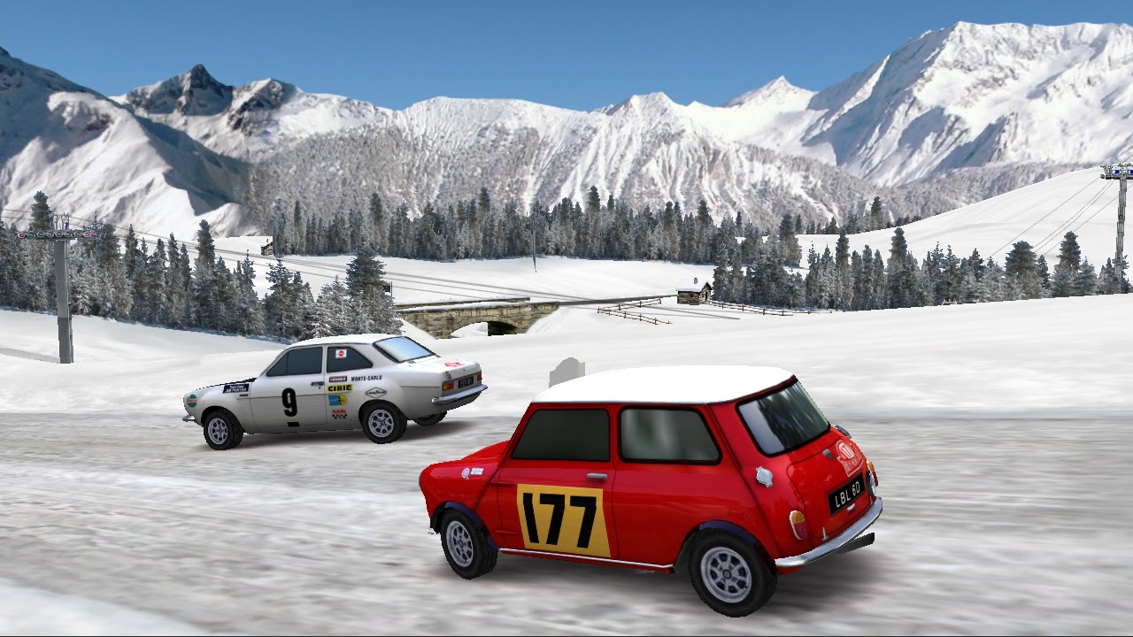 A red Mini chasing a white saloon on a snowy mountain track
